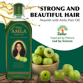 Dabur Amla Hair Oil oil drop texture showing smooth nourishment