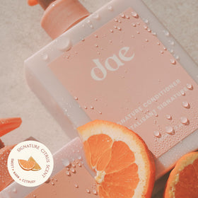DAE conditioner being applied to wet hair to detangle and reduce breakage