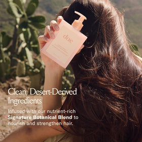 DAE shampoo being worked into wet hair showing lift of buildup and refreshed scalp