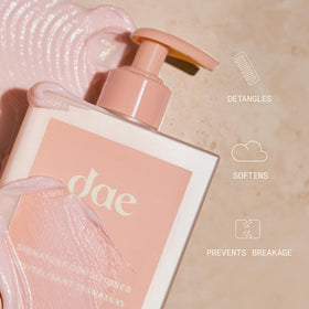 DAE shampoo suds in hand demonstrating gentle lather and effective cleansing