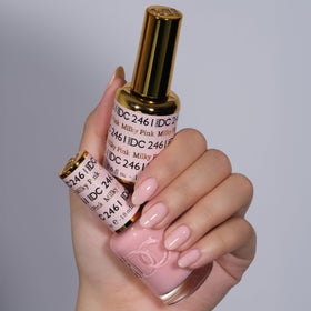 DAISY DND bottle close-up of milky pink shade, precise pigmentation visible