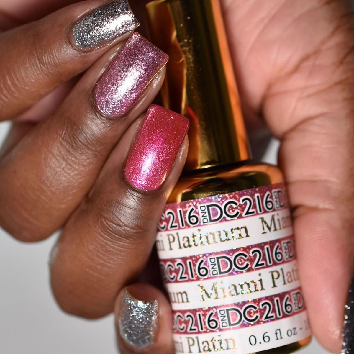 DAISY DND bottles next to ruler showing 0.6 fl oz scale for travel-friendly benefit