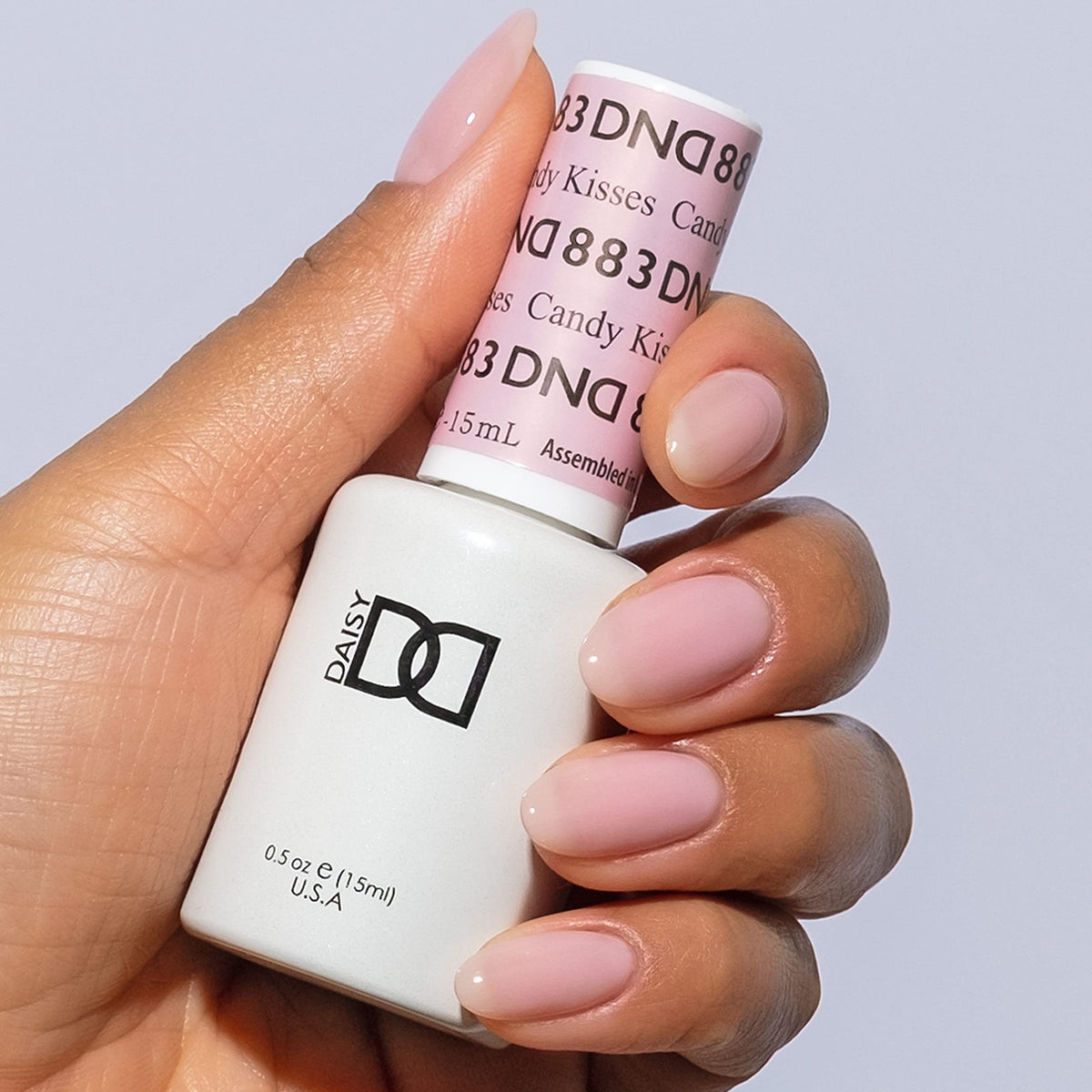 DAISY DND label close-up on Candy Kisses bottle highlighting shade and ingredients