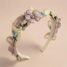 DANRENPANG front view pink butterfly headband showing full floral arrangement and warm tones