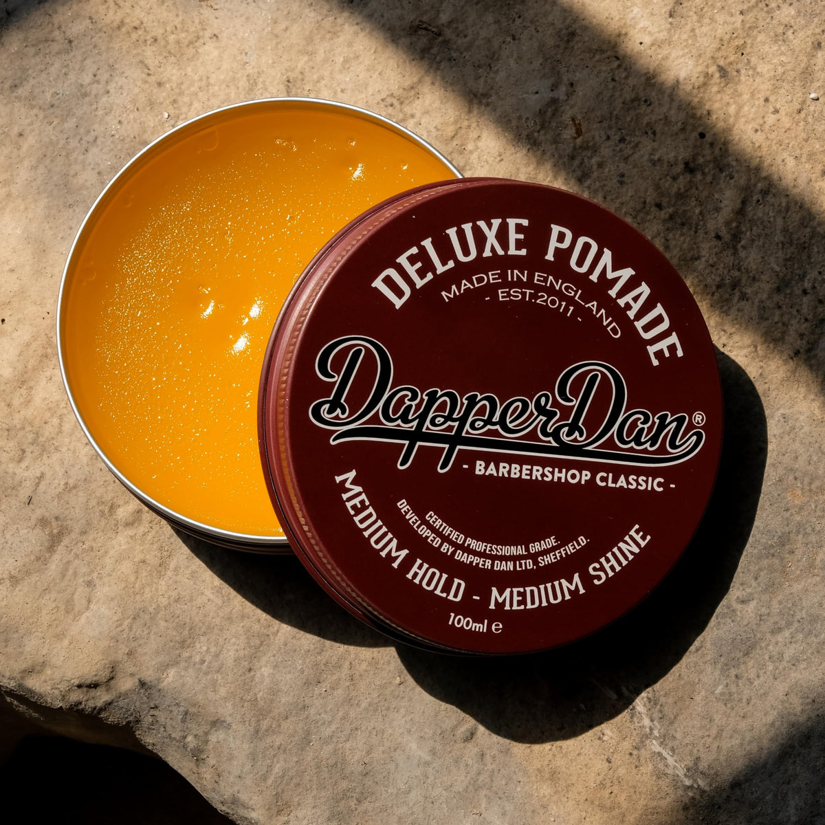 Dapper Dan styled slick-back hair showing medium shine and no greasiness
