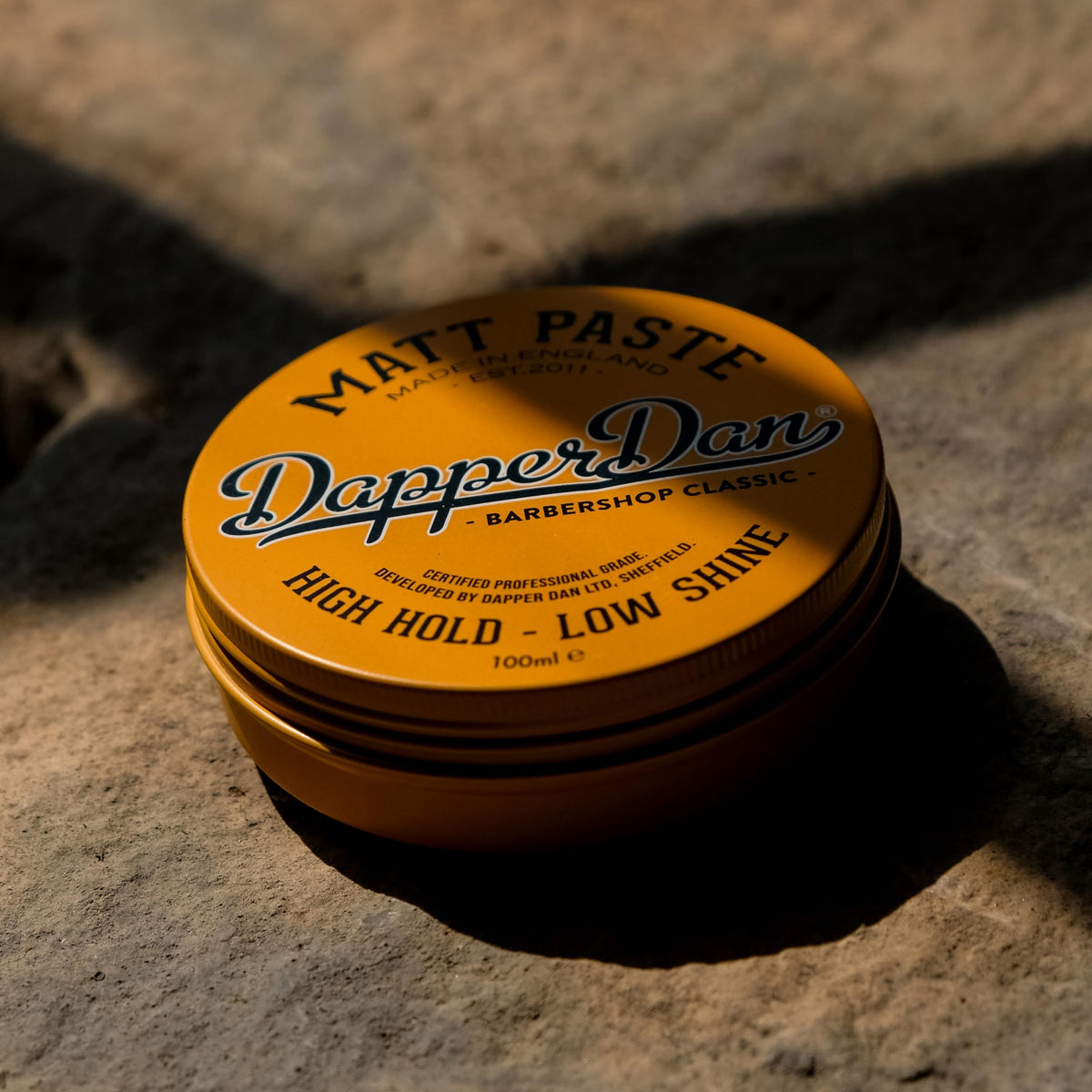Dapper Dan in barbershop use creating textured quiff for lasting style