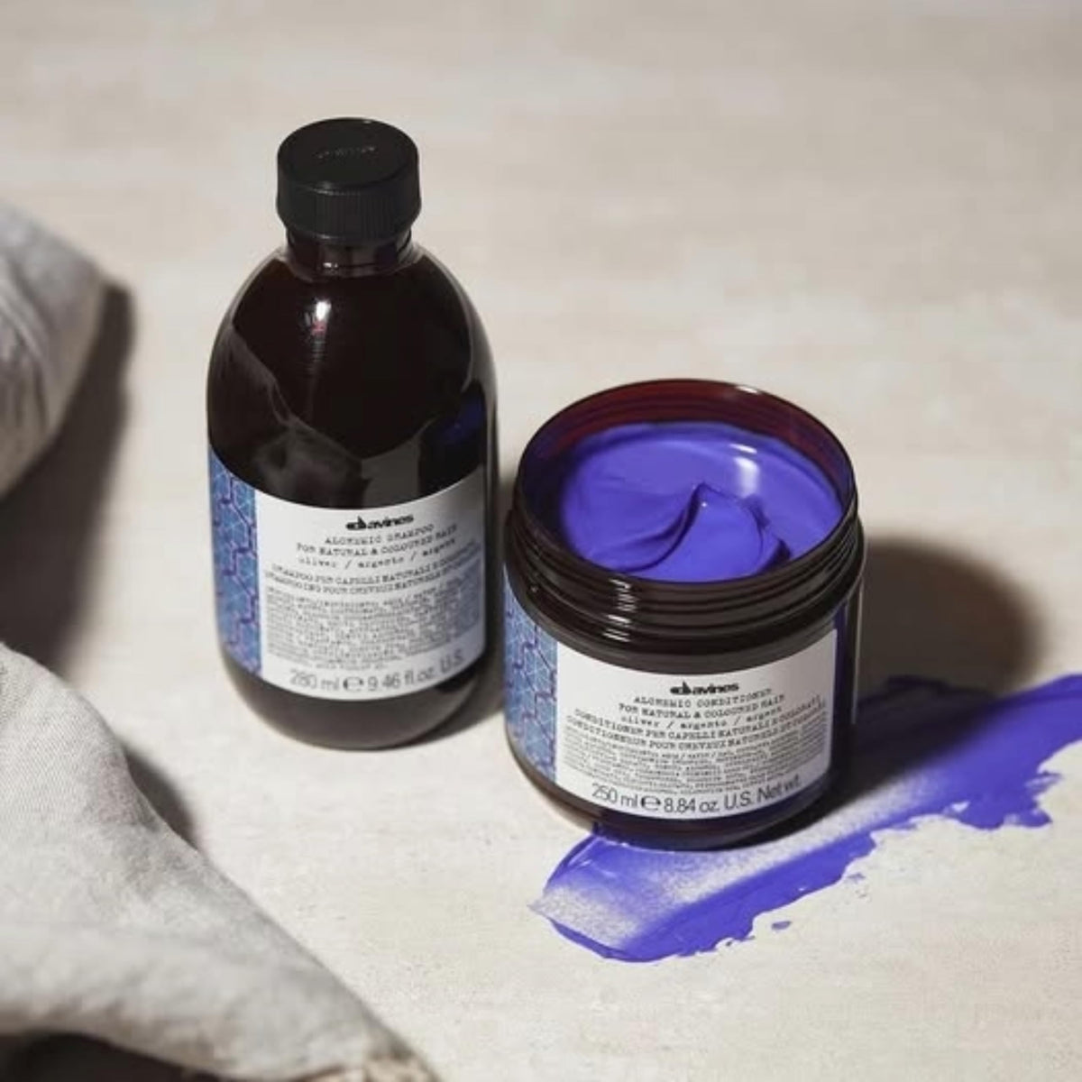 Davines bottle next to ruler for clear size and travel-friendly reference