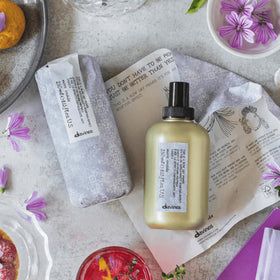 Davines before and after image showing increased lift and natural movement after use