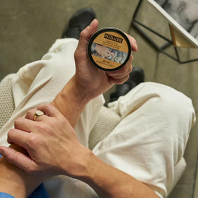 Davines clay on fingers demonstrating smooth application and control