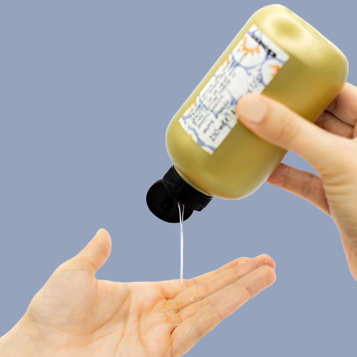 Davines gel applied to wet curls demonstrating defined, elastic curl enhancement benefit