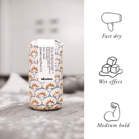 Davines gel held in hand for size comparison and travel-friendly eight-ounce benefit