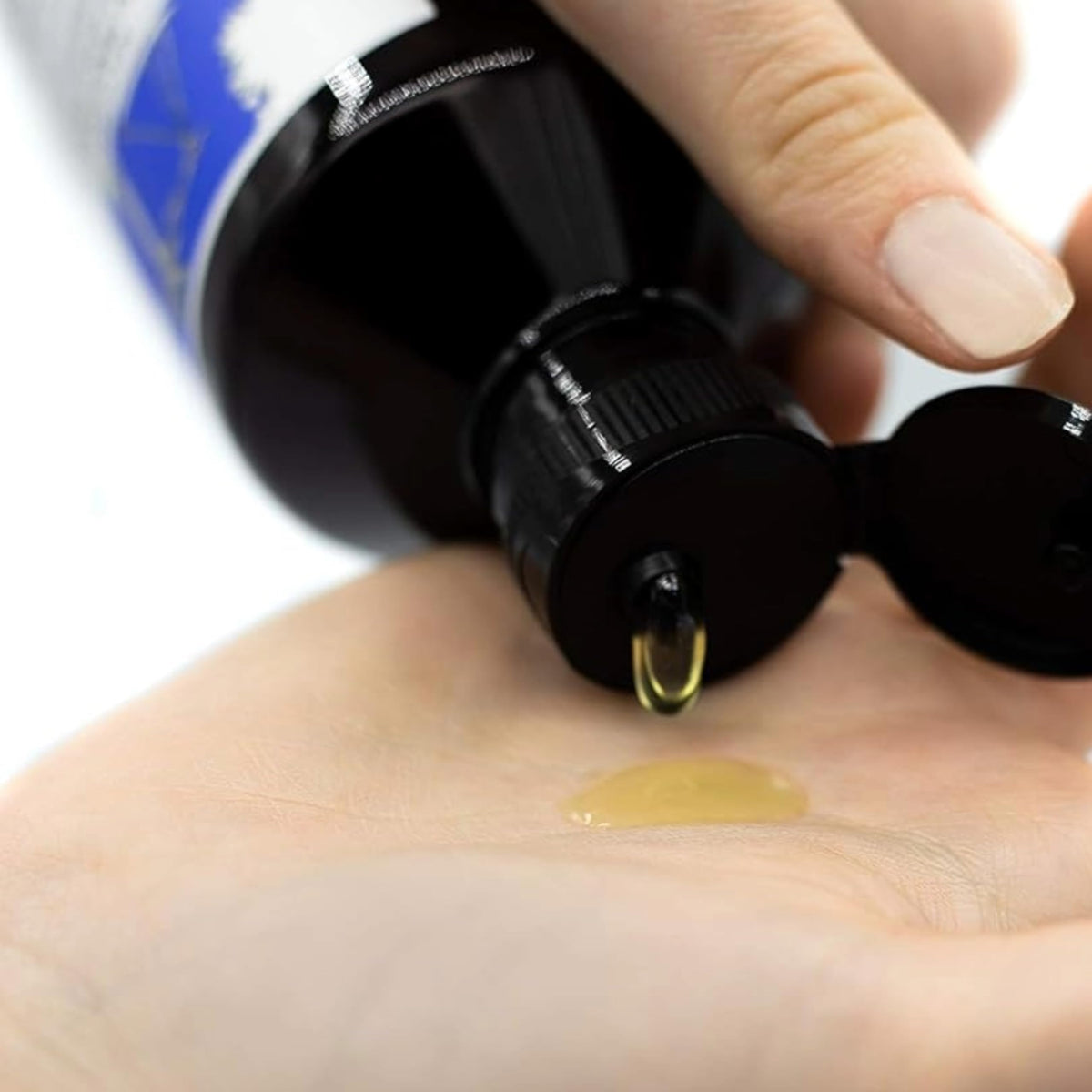 Davines bottle in hand size comparison showing portability and travel convenience benefit