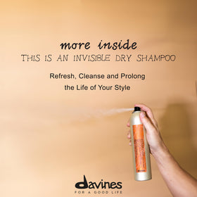 Davines spray mid-action illustrating fine invisible mist and coverage