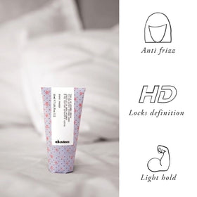 Davines serum applied to damp hair showing satin finish and styling readiness benefit