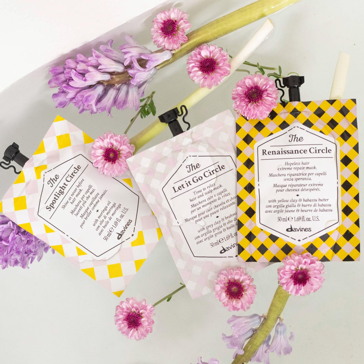 Davines jar beside travel items showing compact 1.69 fl oz convenience