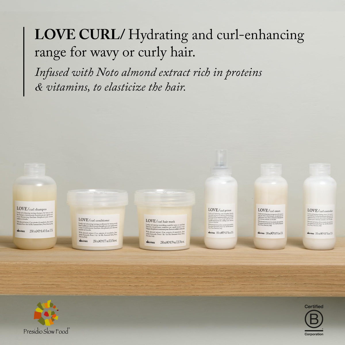 Applying Davines curl cream to damp curly hair for defined, frizz‑free results