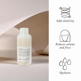 Dispensing Davines LOVE Curl Controller into palm for measured styling benefit