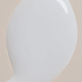 Davines applying milk to damp hair to illustrate improved manageability and heat‑prep