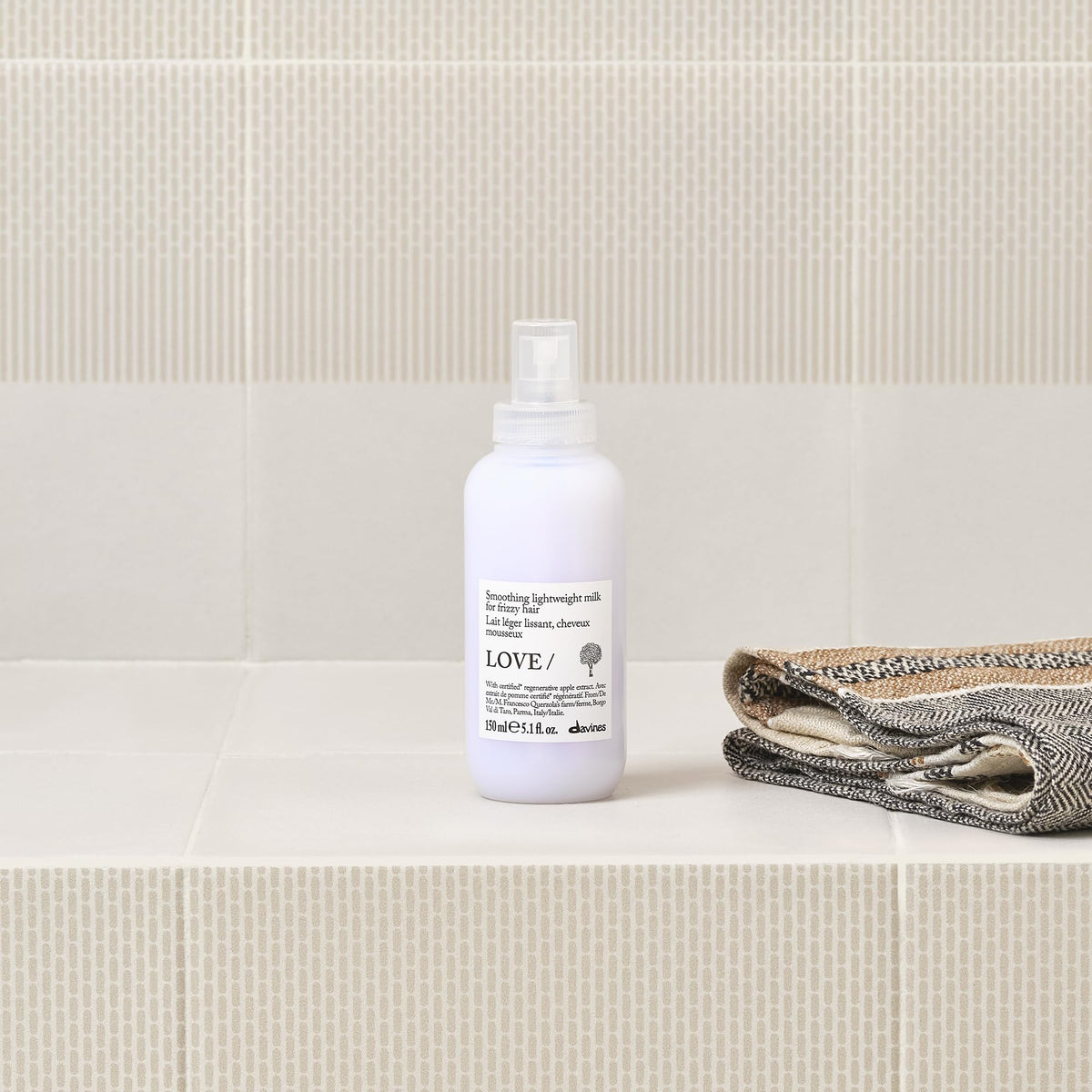 Davines apple pulp ingredient visual emphasizing sustainable sourcing and natural conditioning benefit