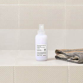 Davines apple pulp ingredient visual emphasizing sustainable sourcing and natural conditioning benefit