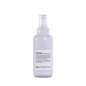 Davines bottle front view showing product for sleek styling and frizz control