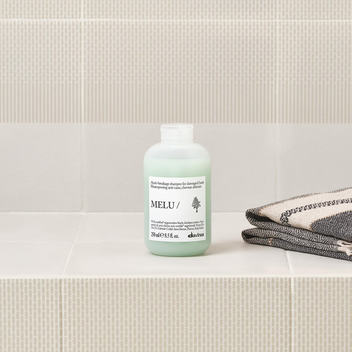 Davines MELU shampoo ingredients display emphasizing regenerative components and protection