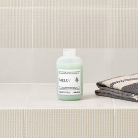 Davines MELU shampoo ingredients display emphasizing regenerative components and protection