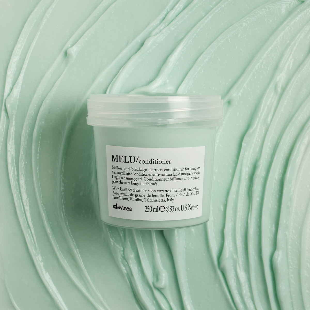 Davines MELU creamy texture in spoon highlighting smooth spreadability and lightweight hydration