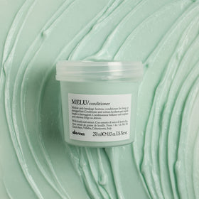 Davines MELU creamy texture in spoon highlighting smooth spreadability and lightweight hydration