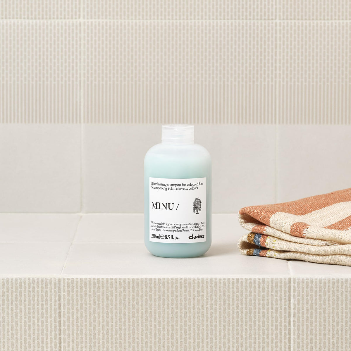 Davines MINU creamy shampoo texture close-up that conditions and cleanses