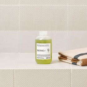Davines MOMO shampoo lathering in shower showing easy rinse and softness