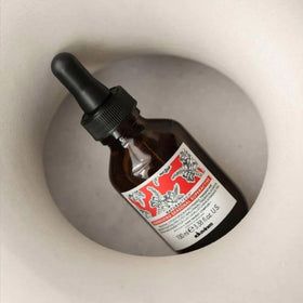 Davines close-up of pump and label highlighting easy, targeted application benefit