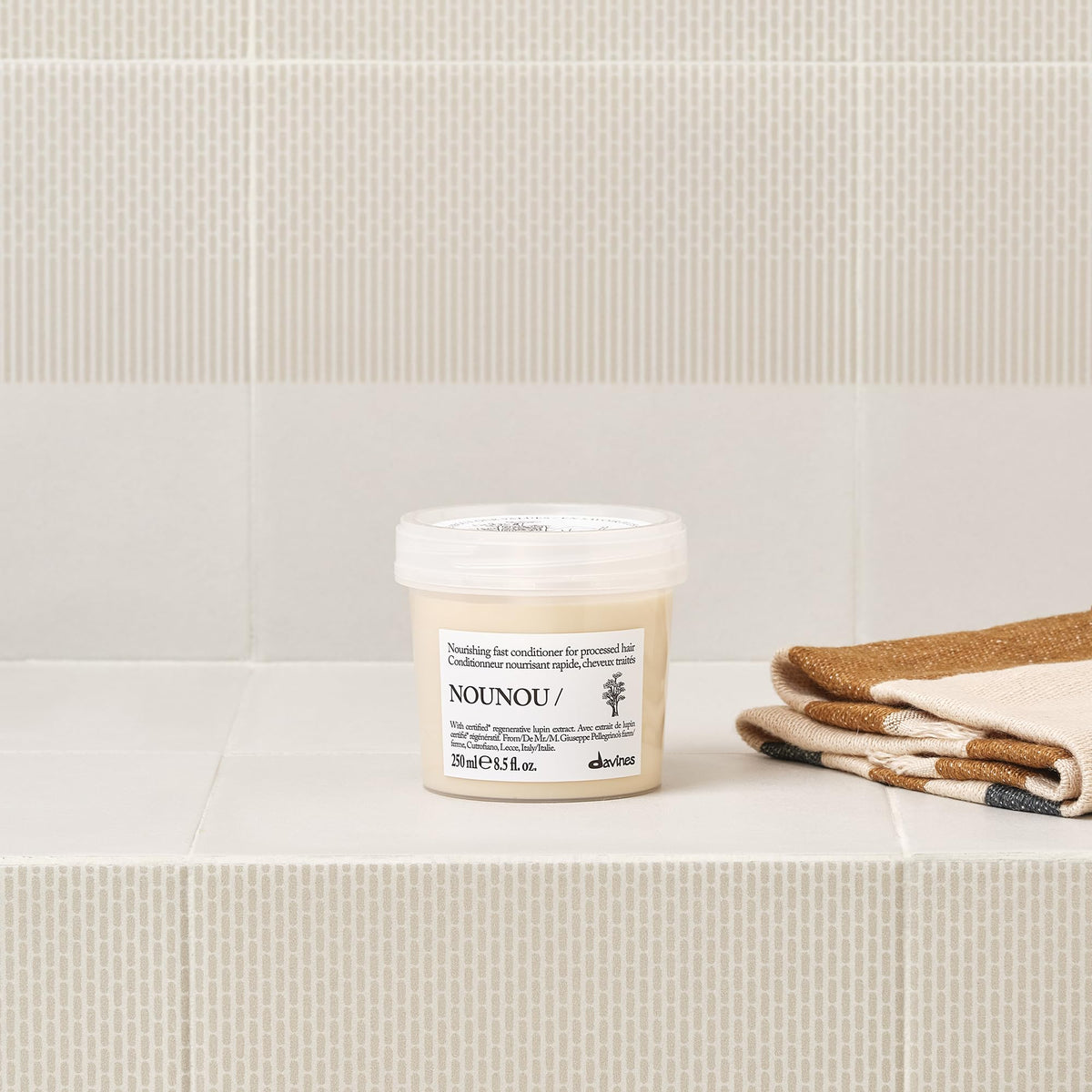 Davines NOUNOU being dispensed to show easy application and portion control