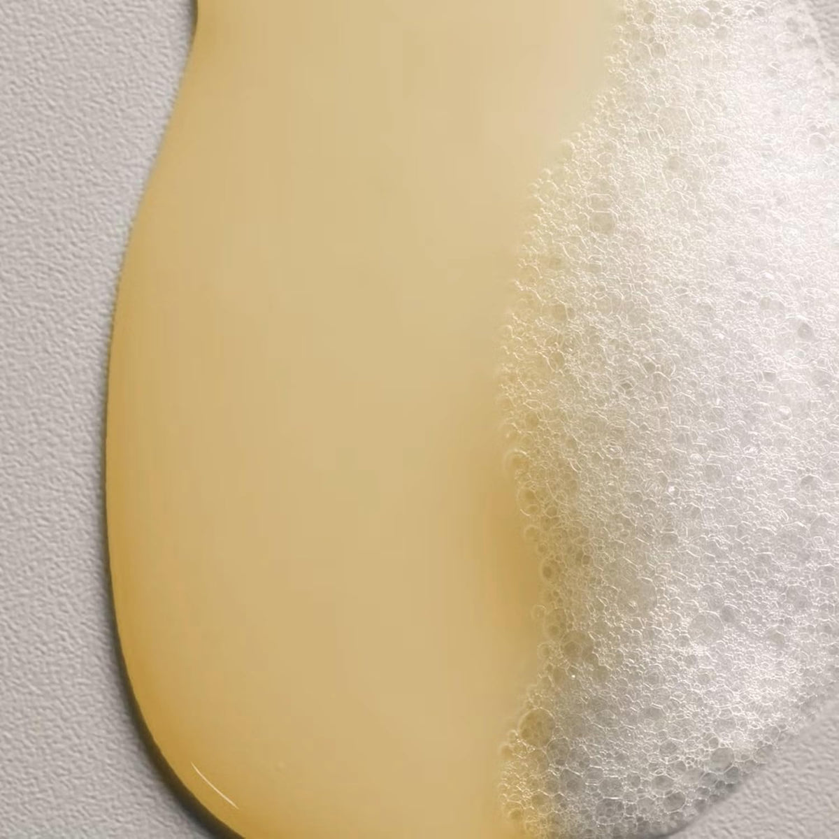 Davines shampoo applied to wet hair in salon, illustrates cleansing and detangling benefit