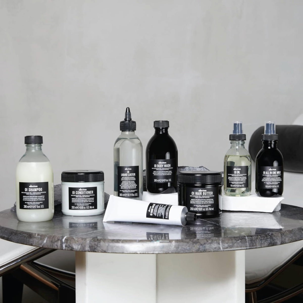 Davines bottle in hand for scale communicating 9.47 fl oz size