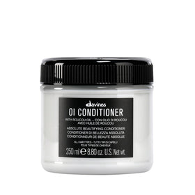 Davines OI conditioner front bottle showing elegant design and professional results