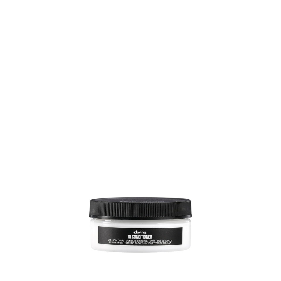 Davines OI Conditioner front packaging shows compact travel bottle and brand benefit