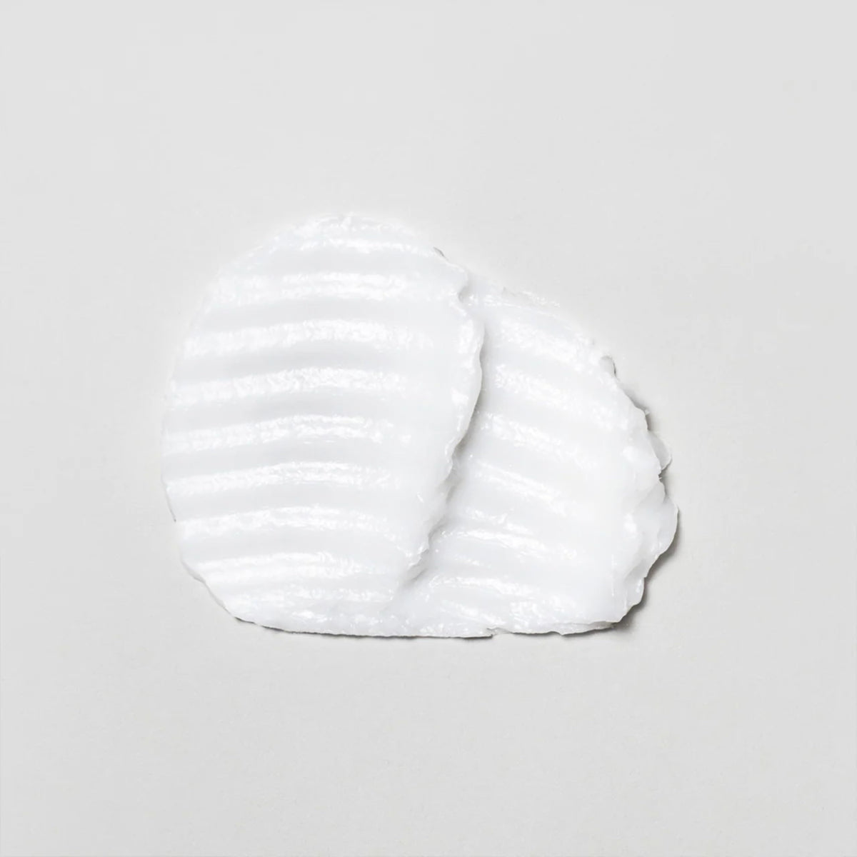 Davines application on damp hair demonstrating smooth spread for frizz control