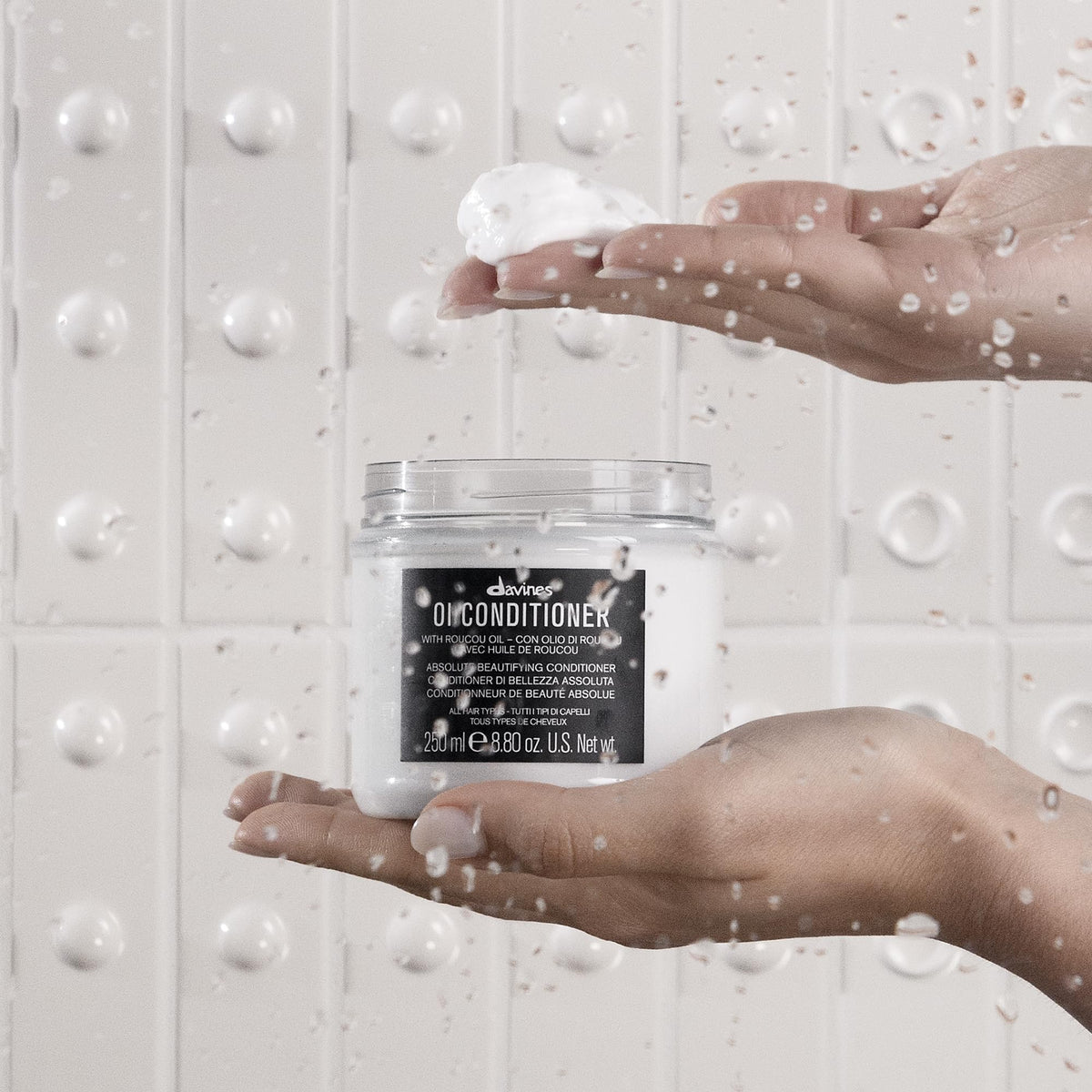 Davines OI hair in use after treatment showing smooth shiny strands and reduced frizz