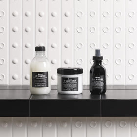 Davines OI placed on hairdresser vanity suggesting professional styling support