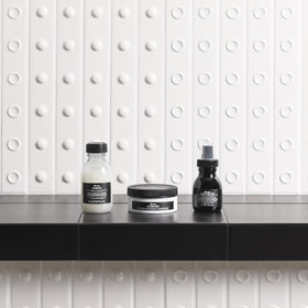 Davines OI milk being applied to damp hair showing detangling and smoothing benefit