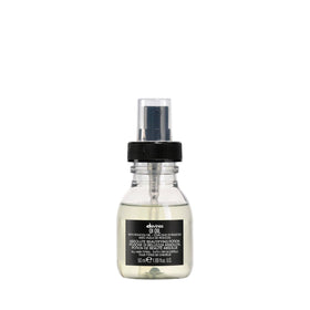 Davines front bottle showing compact travel-size and lightweight shine benefits