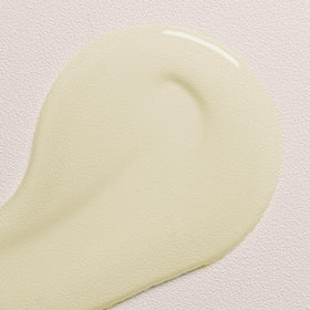 Davines OI Oil held in hand to show scale and travel-friendly convenience