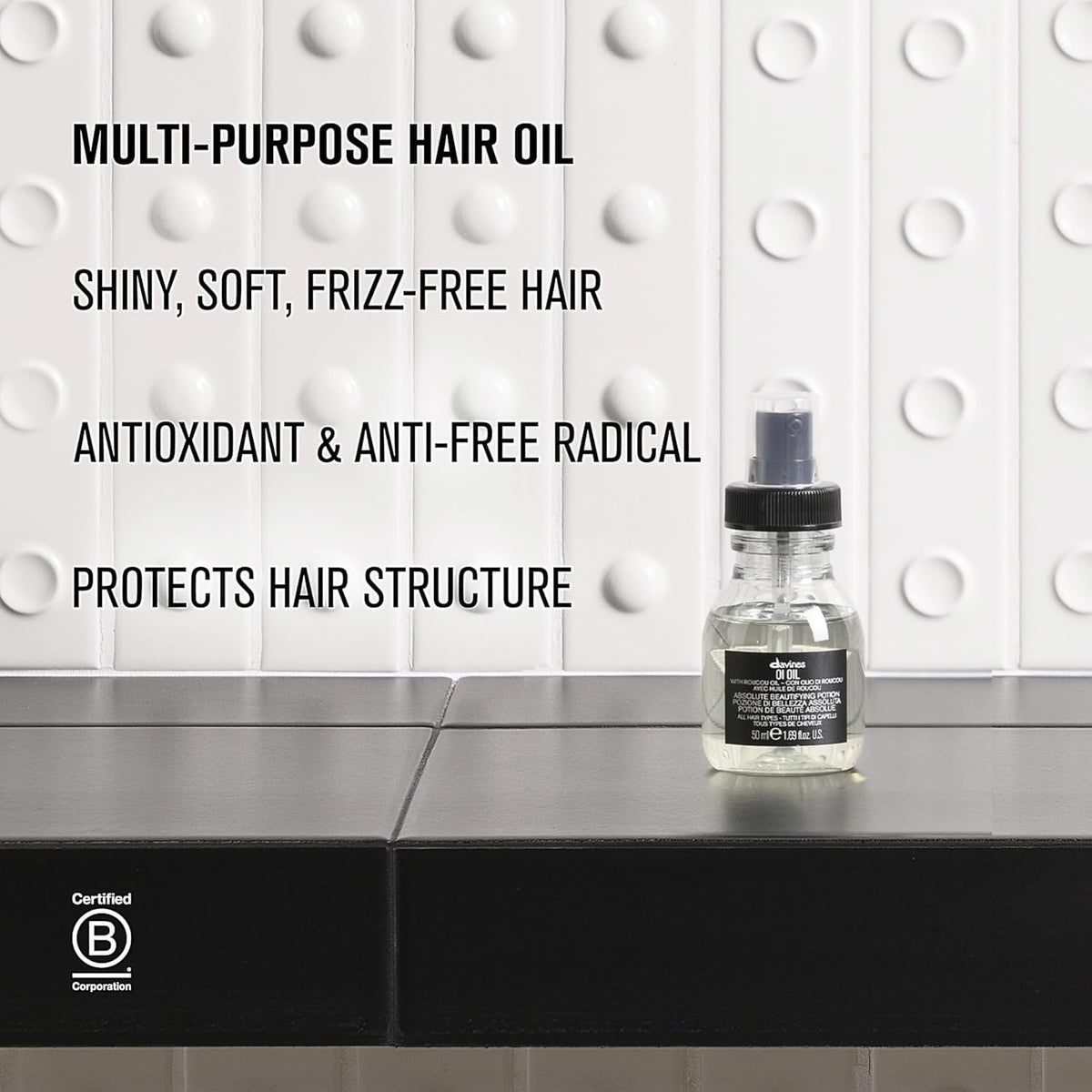 Davines travel size beside passport emphasizing portability and on-the-go styling