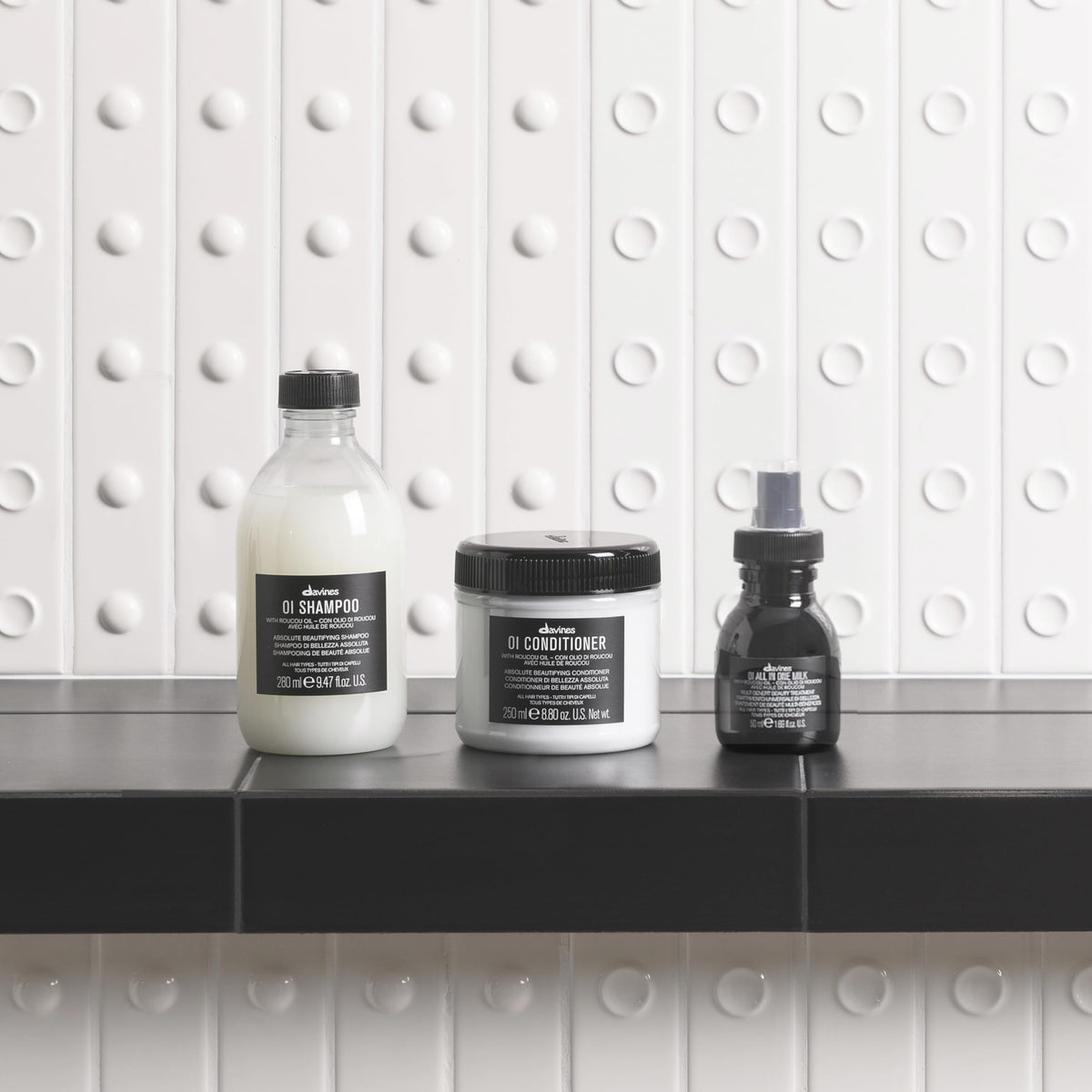Davines OI products lined up side view highlighting routine order and cohesive design