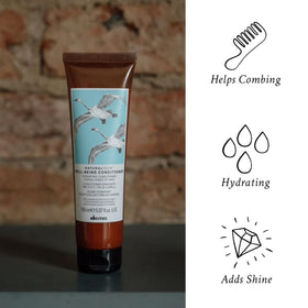 Davines conditioner texture poured to show creamy consistency and slip