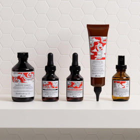 Davines bottle with botanicals showing natural ingredient benefit