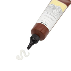 Davines purifying gel size comparison in hand indicating travel-friendly volume