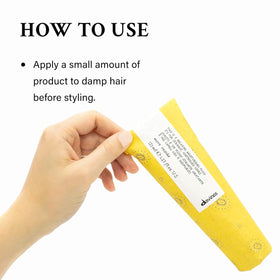 Davines product held in hand for scale showing compact 4.23 fl oz travel-friendly size