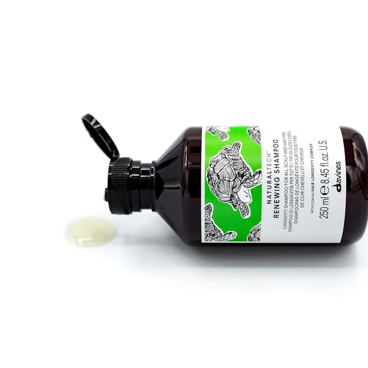 Davines renewing shampoo bottle held in hand for accurate size perception